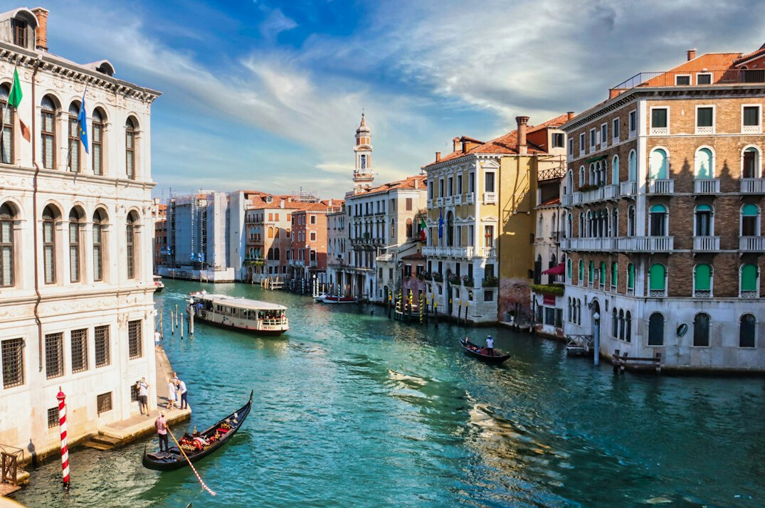 Venice canal with historic buildings and boats